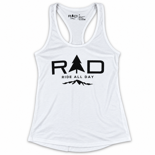 A white racerback tank top with a black graphic print on the front reading 'RAD' with a tree icon inside the 'A', and 'RIDE ALL DAY' below, on a plain white background.